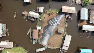 Giant fresco appears in floating Benin village