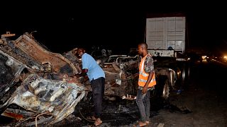At least 8 killed after a trailer crashed into vehicles and burst into flame 